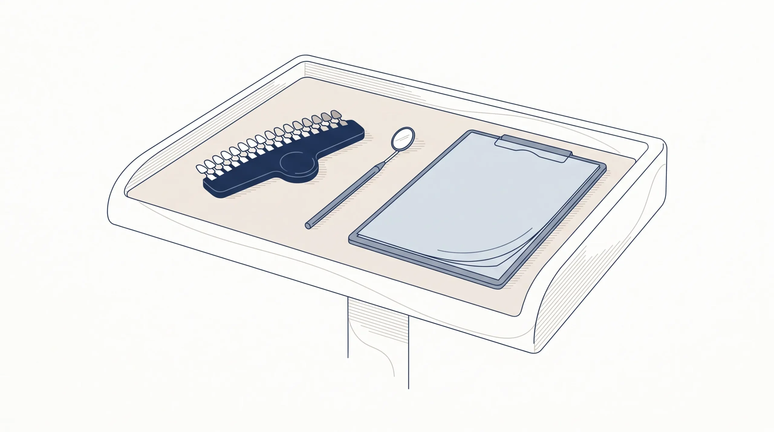 A clean consultation bench holds a tooth shade guide, a dental mirror and blank treatment notes for a veneers appointment.